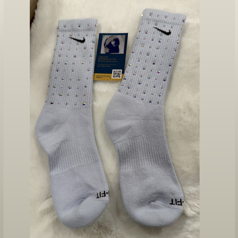 Nike White Crew Socks with Black Swoosh and Colorful Accents